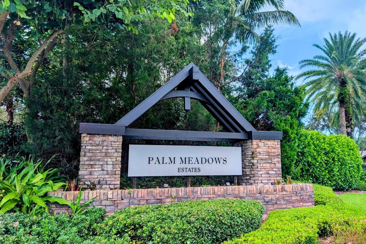 Palm Meadows Estates entry sign in West Boynton Beach, Florida.